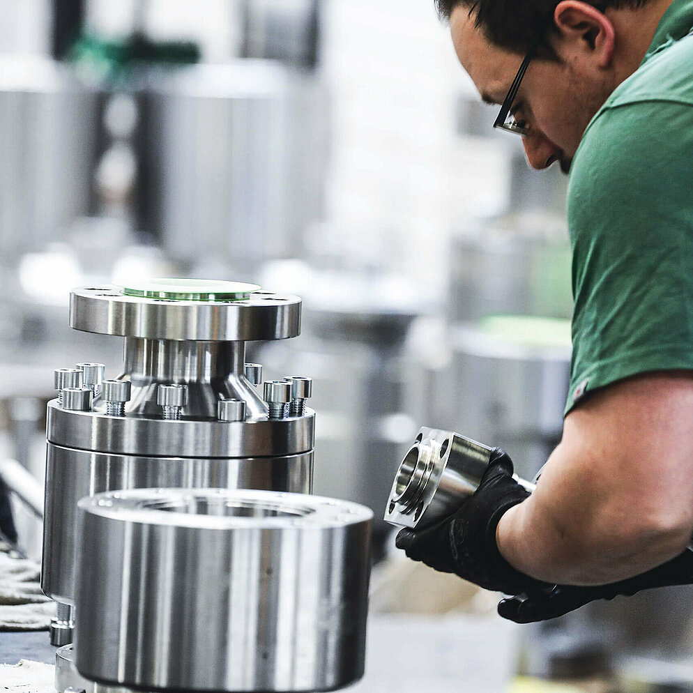 Valve components are assembled by an employee of Schroeder Valves
